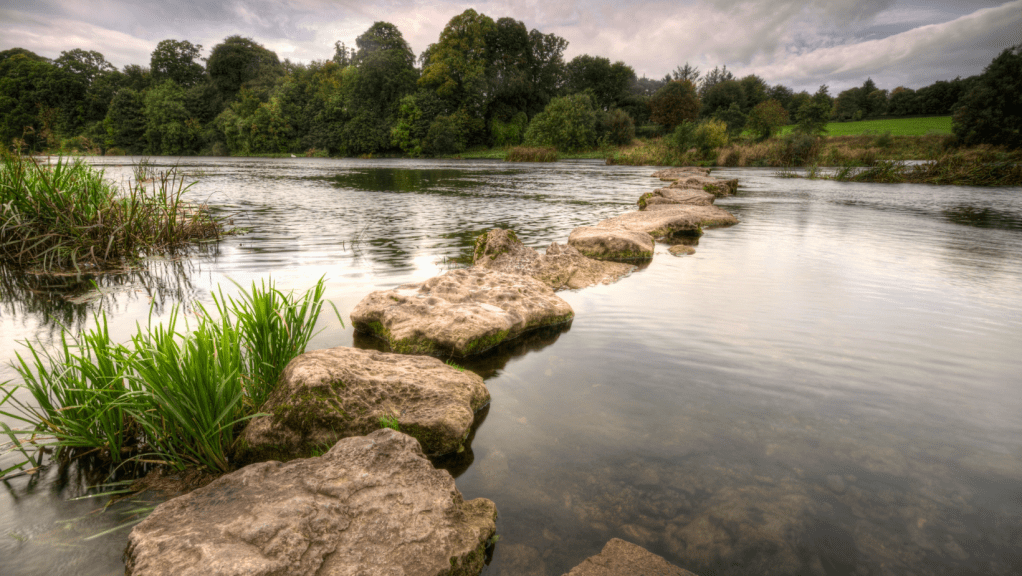 Stepping stones across a river, symbolizing the idea that each failure is a step towards success.